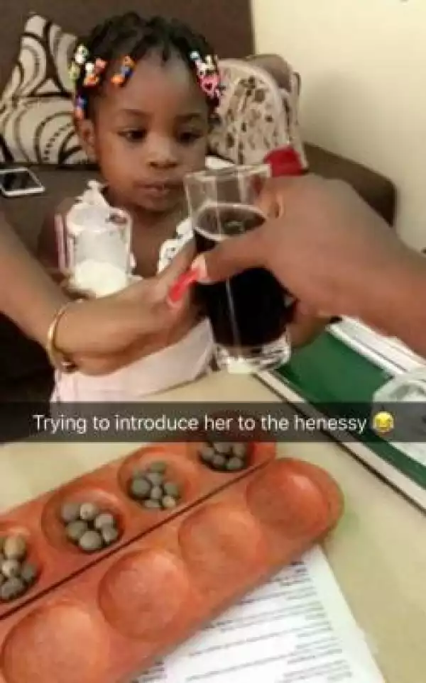 Bizarre: Davido’s Daughter, Imade Introduced to alcohol by her Uncle (Pic)